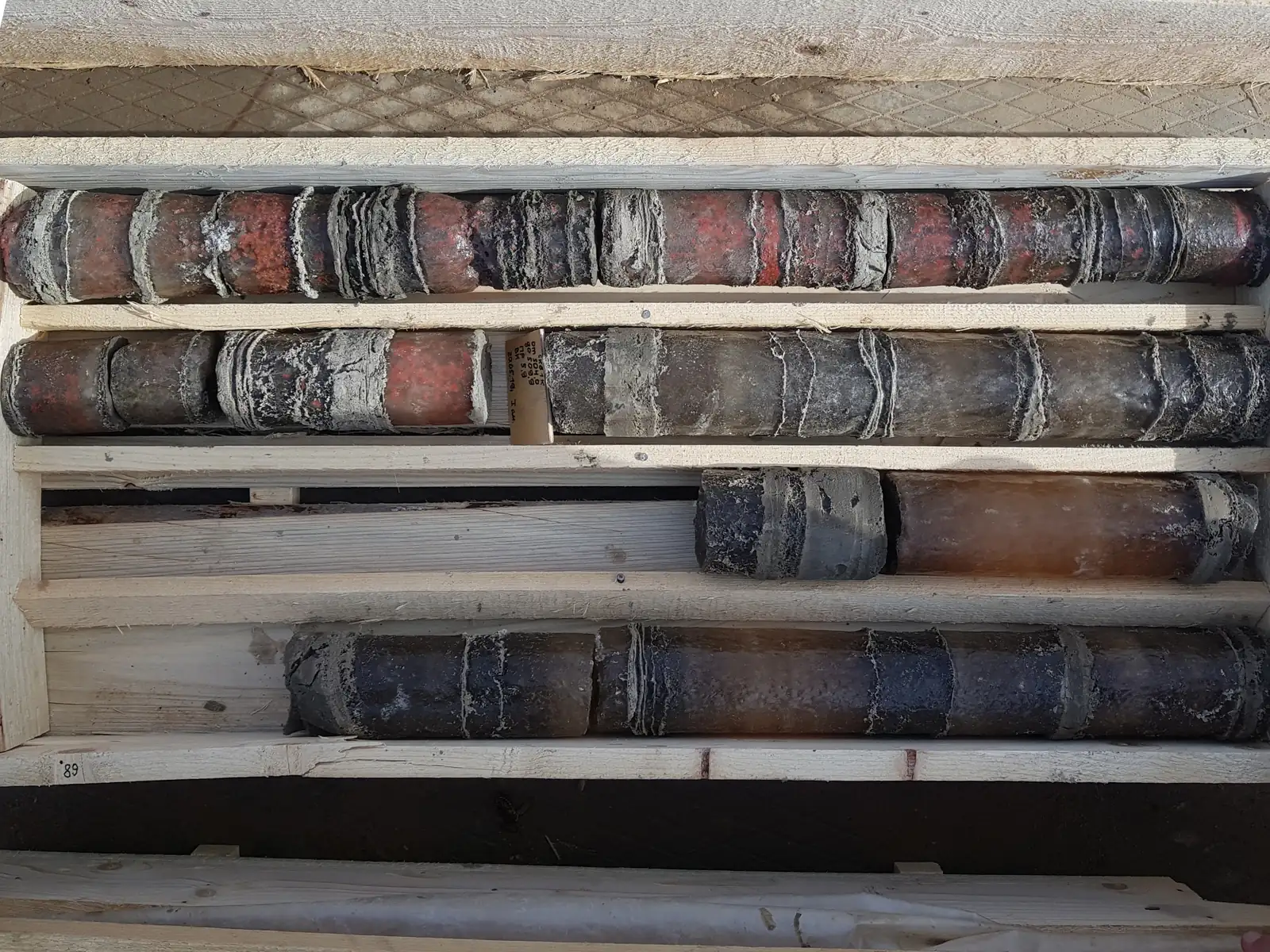 Drill core in boxes. Stock photo.